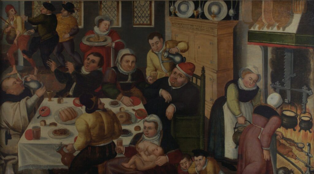 Unknown artist after Peter Bruegel the Elder (Flemish, ca. 1525-1569), The Fat Kitchen, 1600, oil on panel. Gift of Dr. & Mrs. Werner Muensterberger, 1963.11.


In a critique of gluttony and excess, this wry feast scene is loosely modeled after the satirical print The Fat Kitchen, 1563 by Peter Bruegel the Elder. Despite the abundant food on view, the diners do not extend their hospitality to a thin, tattered beggar, who is being pushed out the door. At left a monk is drinking excessively instead of exhibiting temperate, religious behavior. The scene is descriptive as well as prescriptive, offering a sense of what furniture, clothing, and food preparation looked like in 1600 in the Netherlands and Flanders. 


Bruegel’s Fat Kitchen was produced as one of a pair of prints, along with The Thin Kitchen, which shows starving peasants fighting for scraps. The extremes of feast and famine remind viewers that fortune can shift, suggesting moderation as the ideal path.