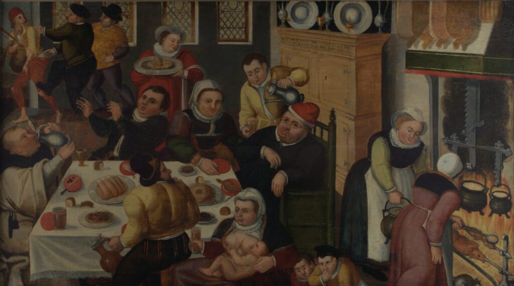 Unknown artist after Peter Bruegel the Elder (Flemish, ca. 1525-1569), The Fat Kitchen, 1600, oil on panel. Gift of Dr. & Mrs. Werner Muensterberger, 1963.11.


In a critique of gluttony and excess, this wry feast scene is loosely modeled after the satirical print The Fat Kitchen, 1563 by Peter Bruegel the Elder. Despite the abundant food on view, the diners do not extend their hospitality to a thin, tattered beggar, who is being pushed out the door. At left a monk is drinking excessively instead of exhibiting temperate, religious behavior. The scene is descriptive as well as prescriptive, offering a sense of what furniture, clothing, and food preparation looked like in 1600 in the Netherlands and Flanders. 


Bruegel’s Fat Kitchen was produced as one of a pair of prints, along with The Thin Kitchen, which shows starving peasants fighting for scraps. The extremes of feast and famine remind viewers that fortune can shift, suggesting moderation as the ideal path.