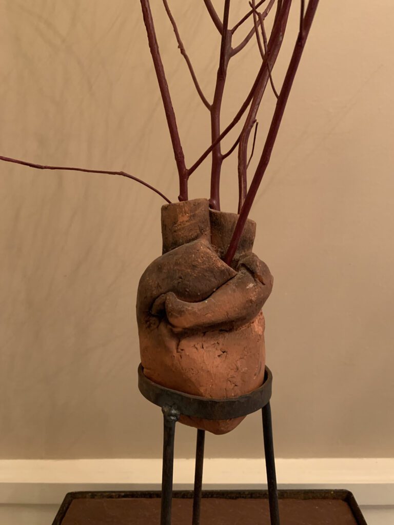 alternate view - Ana Flores, Heart of the Forest, 1999, clay, metal, branches. Courtesy of the artist.