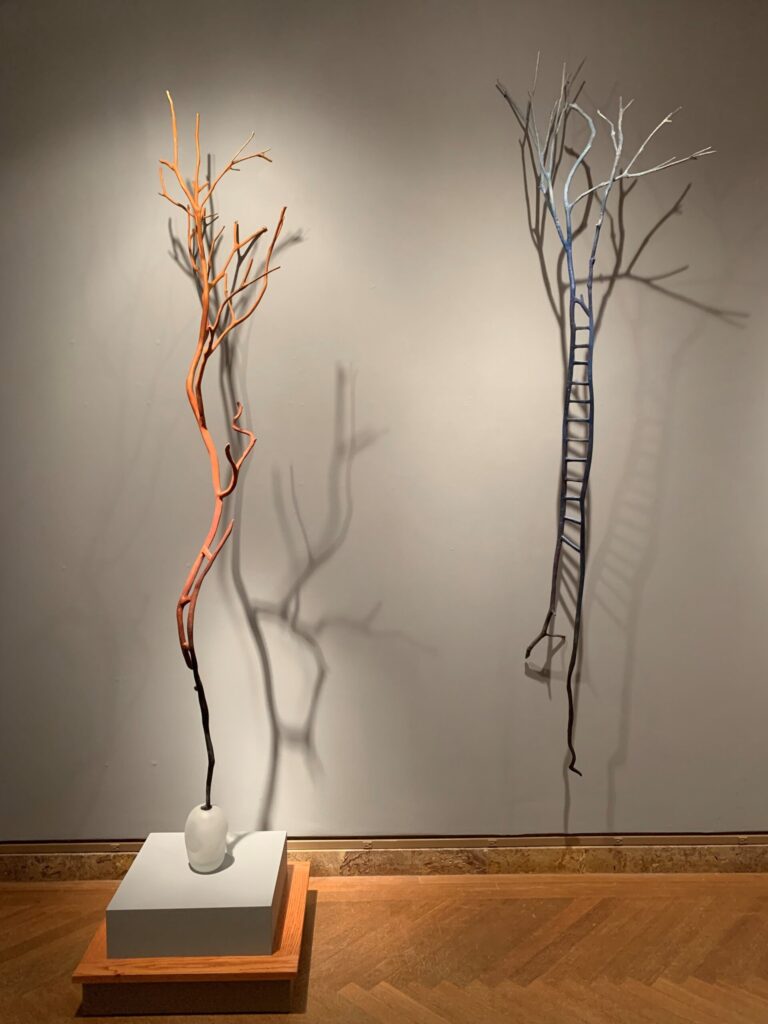 Left: Ana Flores, Rust Shaman Ladder, 2021, aluminum, blown glass. Courtesy of the artist; Right: Ana Flores, Blue Shaman Ladder, 2021, aluminum, Courtesy of the artist.