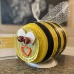 Art project made of recycled materials made to look like a bee,
