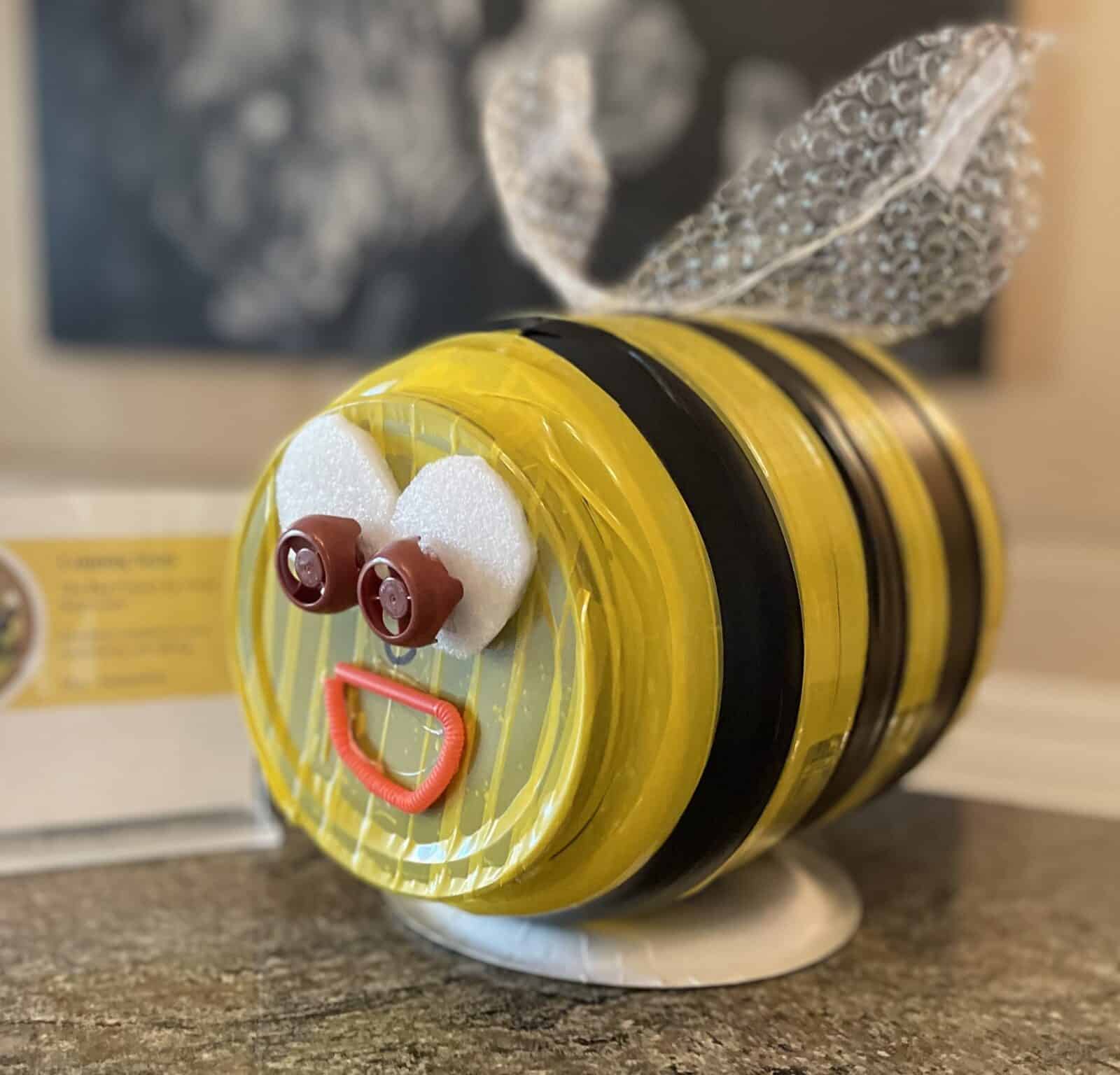 Art project made of recycled materials made to look like a bee,